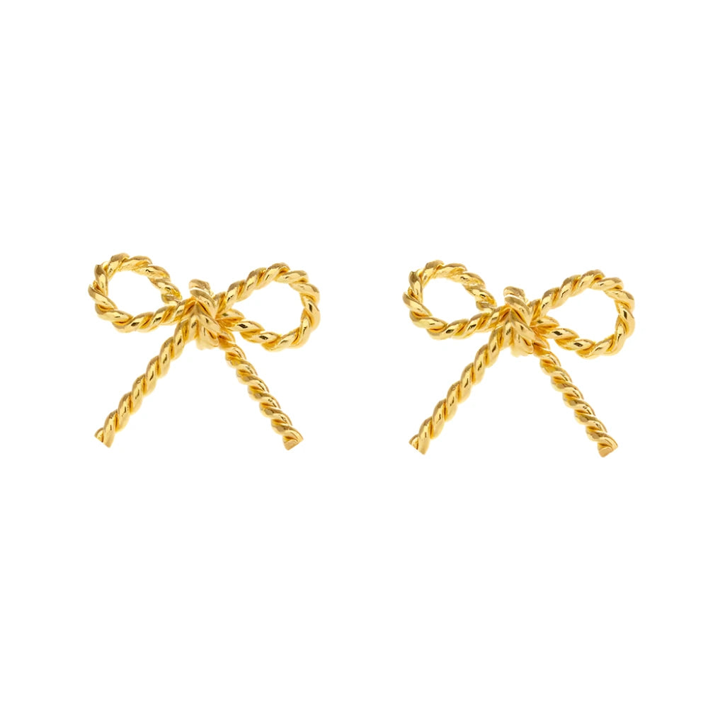 A pair of gold bow stud earrings with a twisted rope design, displayed against a white background. The earrings feature a delicate and symmetrical bow shape for a classic, elegant look.