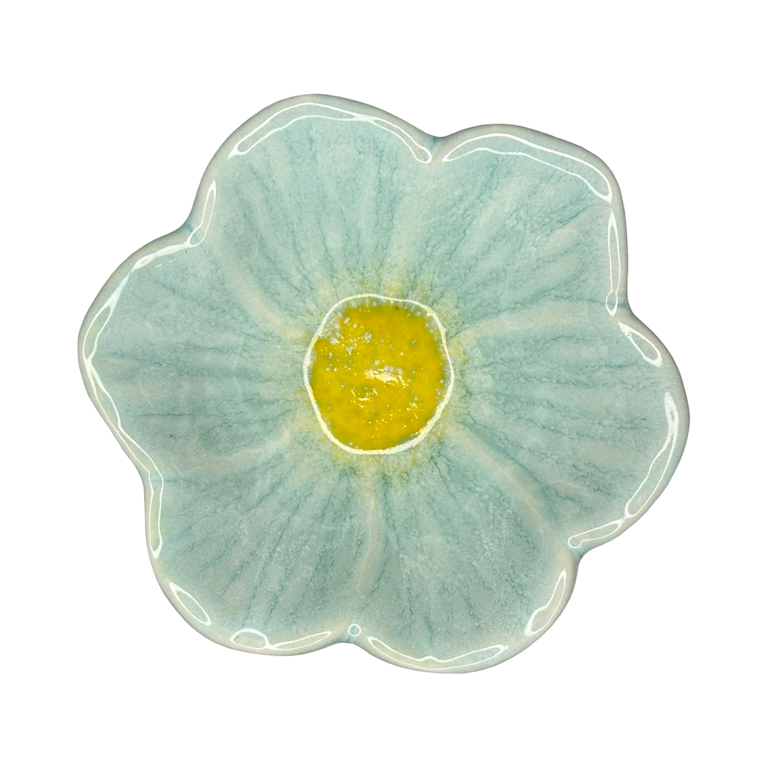 Stoneware flower-shaped bowl in light aqua with a golden center glaze.