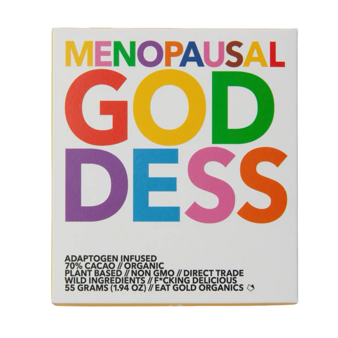 A box of "Menopausal Goddess" chocolate by Eat Gold Organics, featuring bold, colorful typography. The packaging highlights key product details, including 70% cacao, organic, plant-based, non-GMO, direct trade, and adaptogen-infused ingredients.