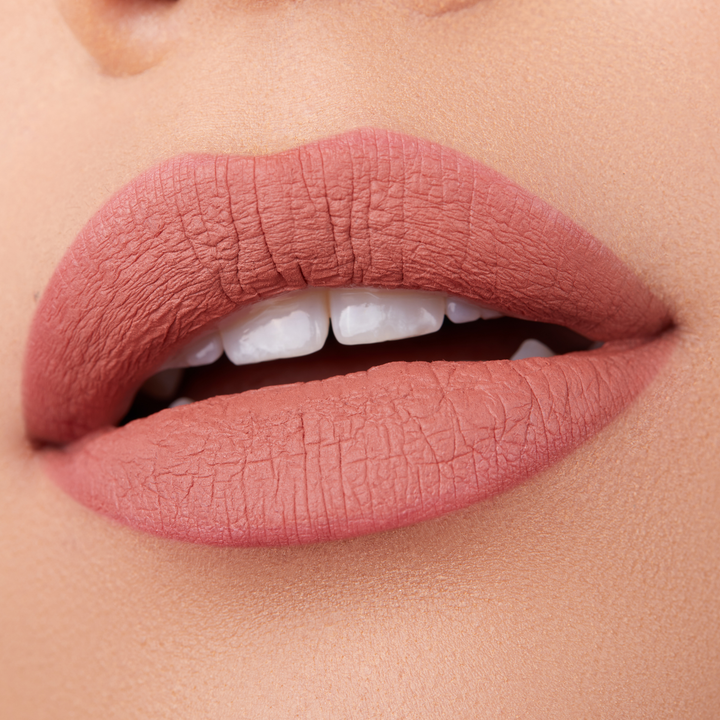 close up of a pair of lips with light pink lipstickBrand: Araceli Beauty