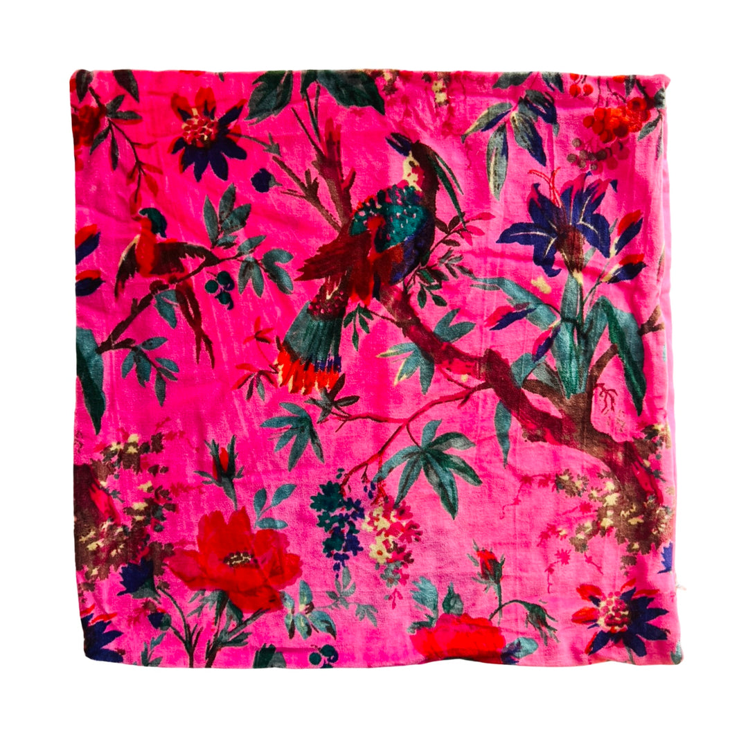 Hot pink velvet square pillow cover with a floral and bird design.