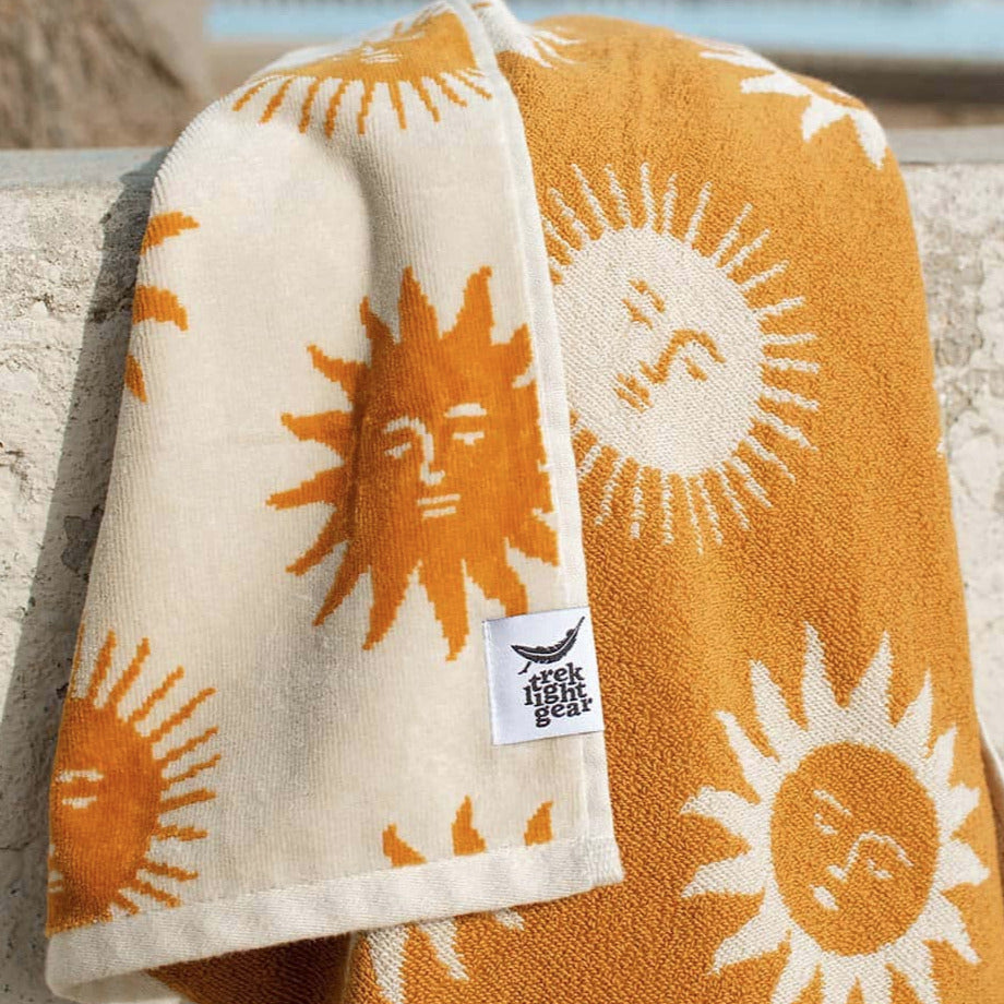 close up view of a towel with a sun pattern design