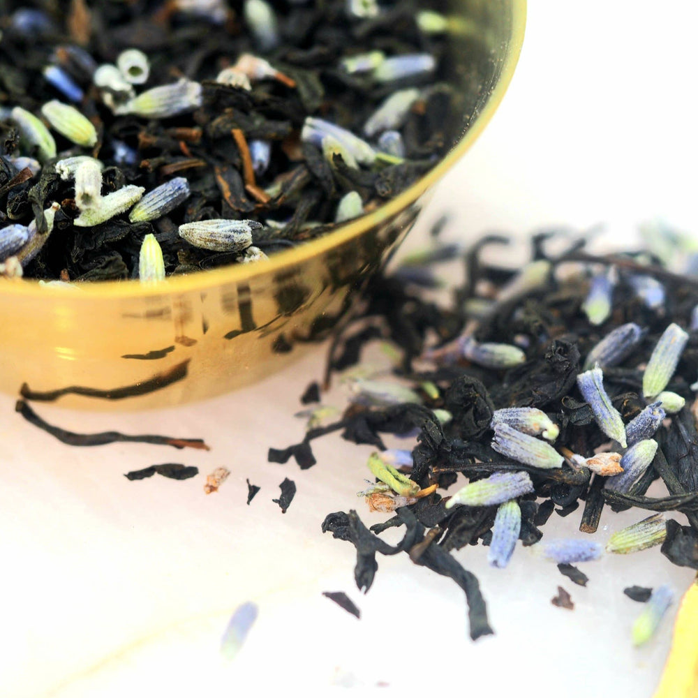 close up view of dried earl grey and lavender in a bowl and table. Brand: Loveyenergy & Blessings