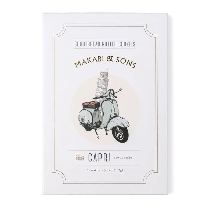 A box of Makabi & Sons Capri Shortbread Butter Cookies, featuring a vintage-style illustration of a classic scooter with the Leaning Tower of Pisa in the background. The packaging highlights the lemon poppy flavor of the cookies.