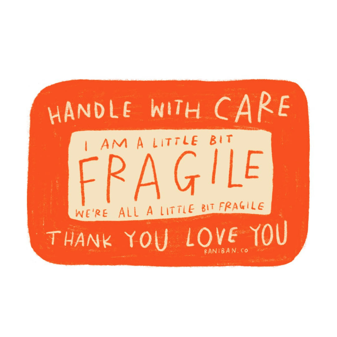 Orange rectangle sticker with a beige center and the following phrase in beige and orange lettering: handle with care, I am a little bit fragile, we're all a little bit fragile, thank you love you.