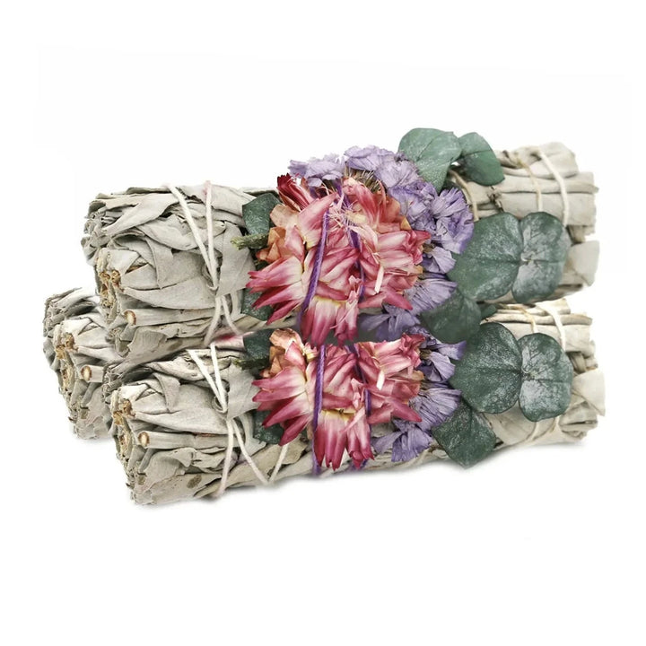3 sage bundles with pink and purple flowers along with eucalyptus.