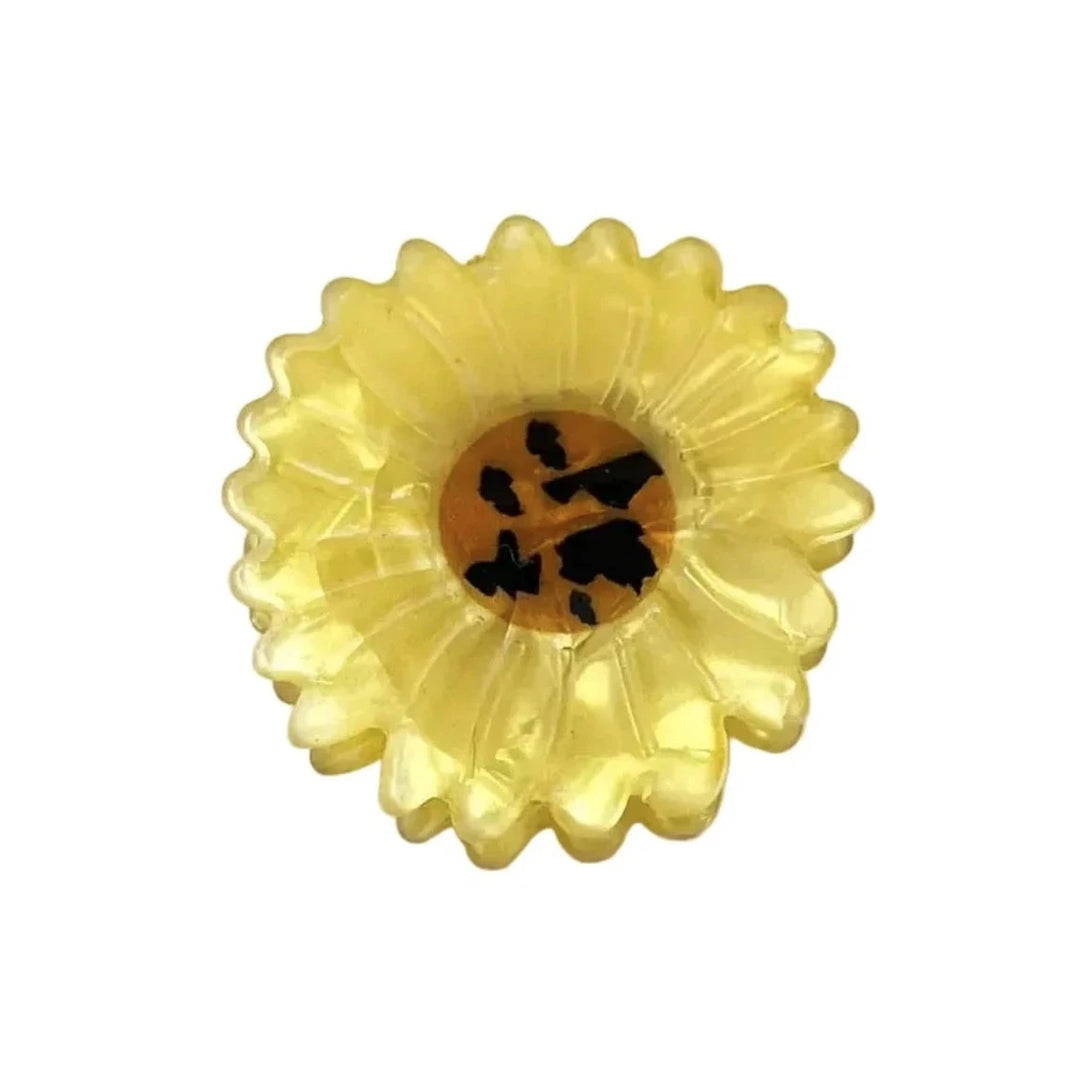 Yellow translucent mini daisy hair claw clip with a detailed brown center.