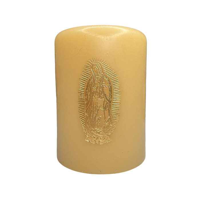 Ivory candle featuring a gold foil stamped image of Our Lady of Guadalupe on the front.