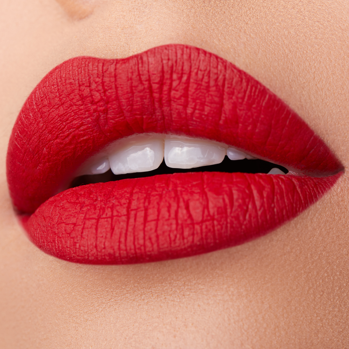 close up of a pair of lips with red lipstickBrand: Araceli Beauty