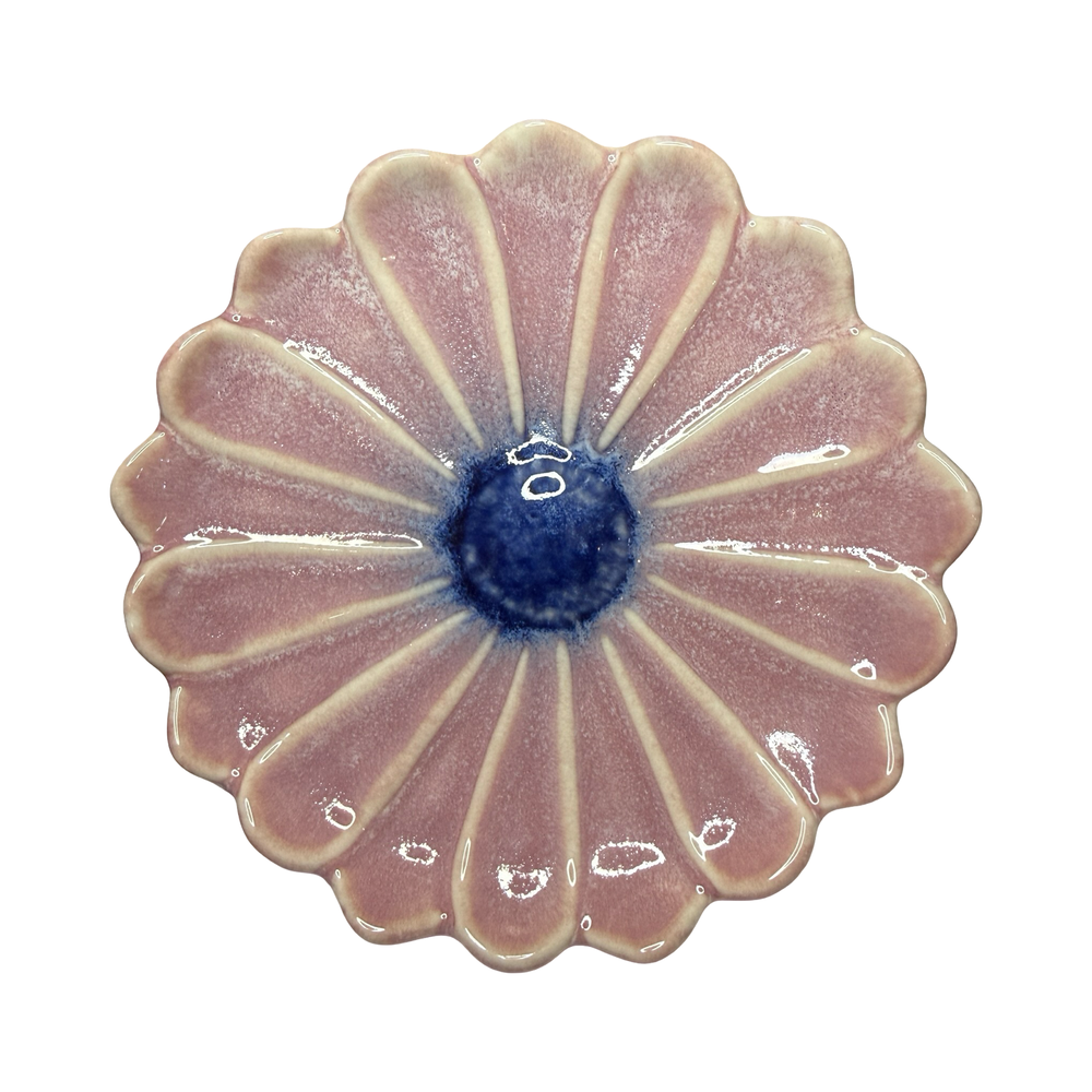 Stoneware flower-shaped dish in pink with a blue center glaze