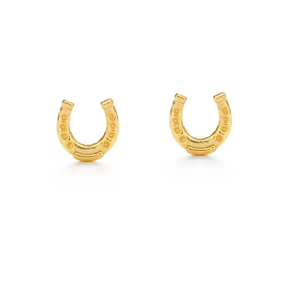 Small gold horseshoe-shaped stud earrings with textured detailing,