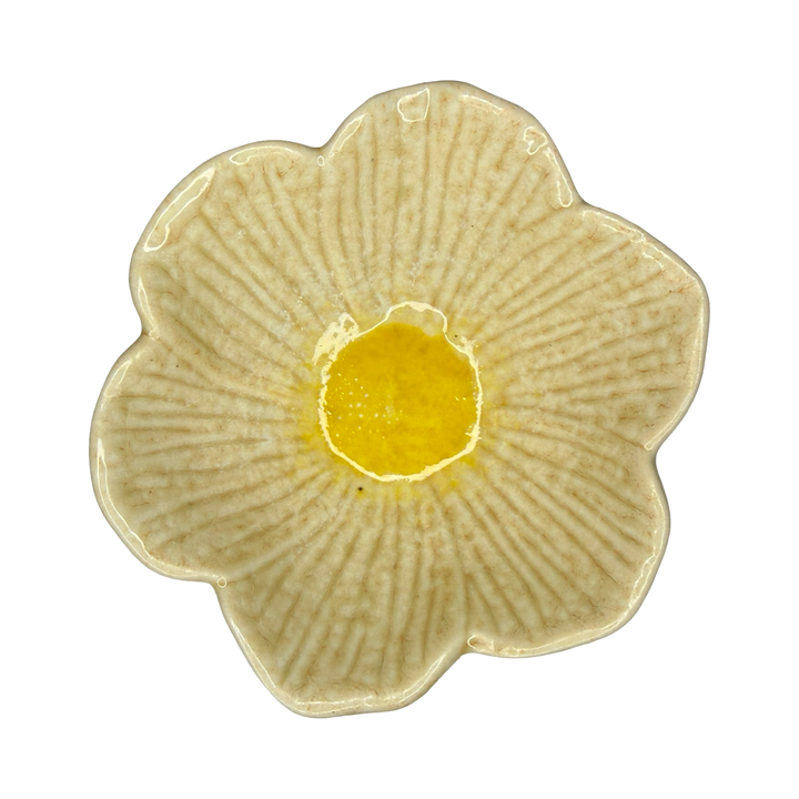 Stoneware flower-shaped bowl in light beige with a golden center glaze.