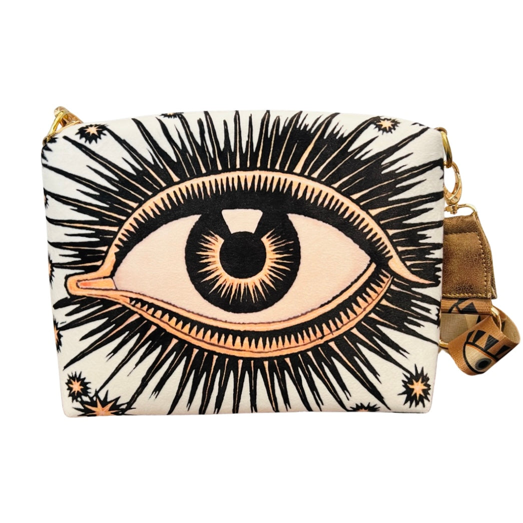 white bag with an image of an eye featuring eyelashes and stars