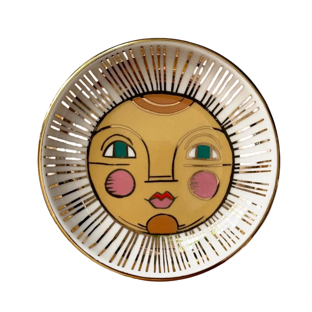 A decorative dish showcasing a vibrant sun illustration with a cheerful face, accented by golden rays radiating outward. 