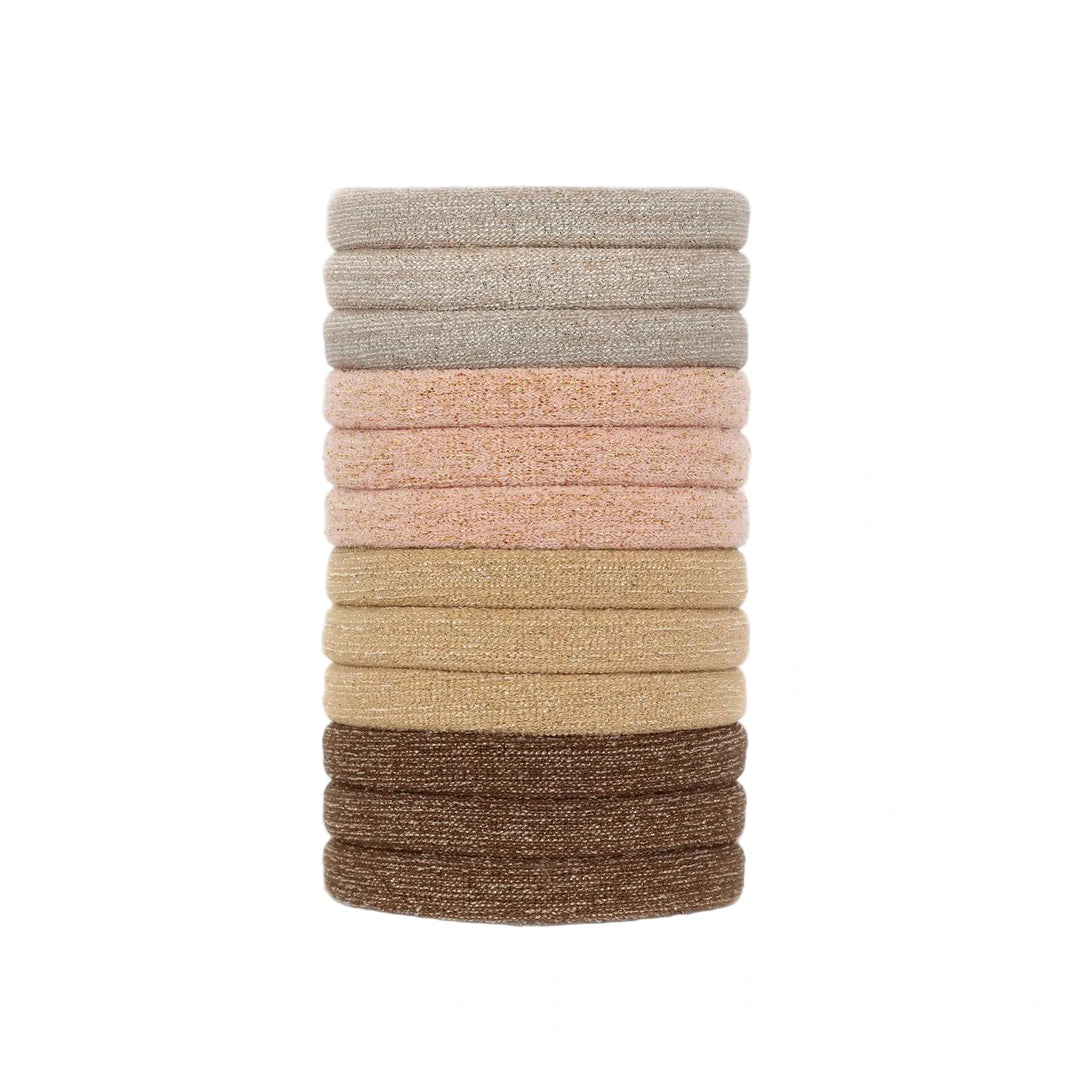 Stack of twelve medium nylon glitter hair elastics in assorted neutral shades including beige, peach, tan, and brown.
