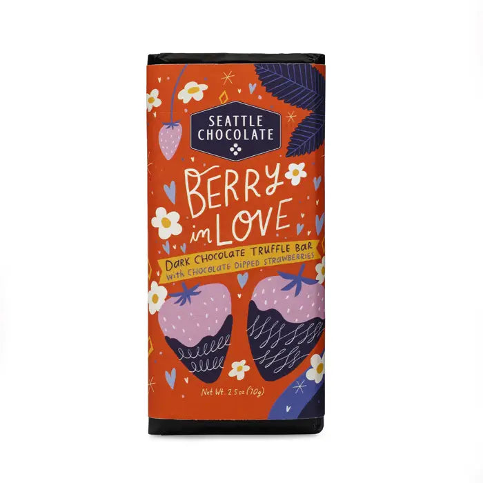 A Seattle Chocolate Berry in Love Dark Chocolate Truffle Bar in a whimsical, colorful wrapper featuring strawberries, flowers, and handwritten-style lettering. The packaging highlights the flavor combination of dark chocolate and chocolate-dipped strawberries, with a net weight of 2.5 oz (70 g).