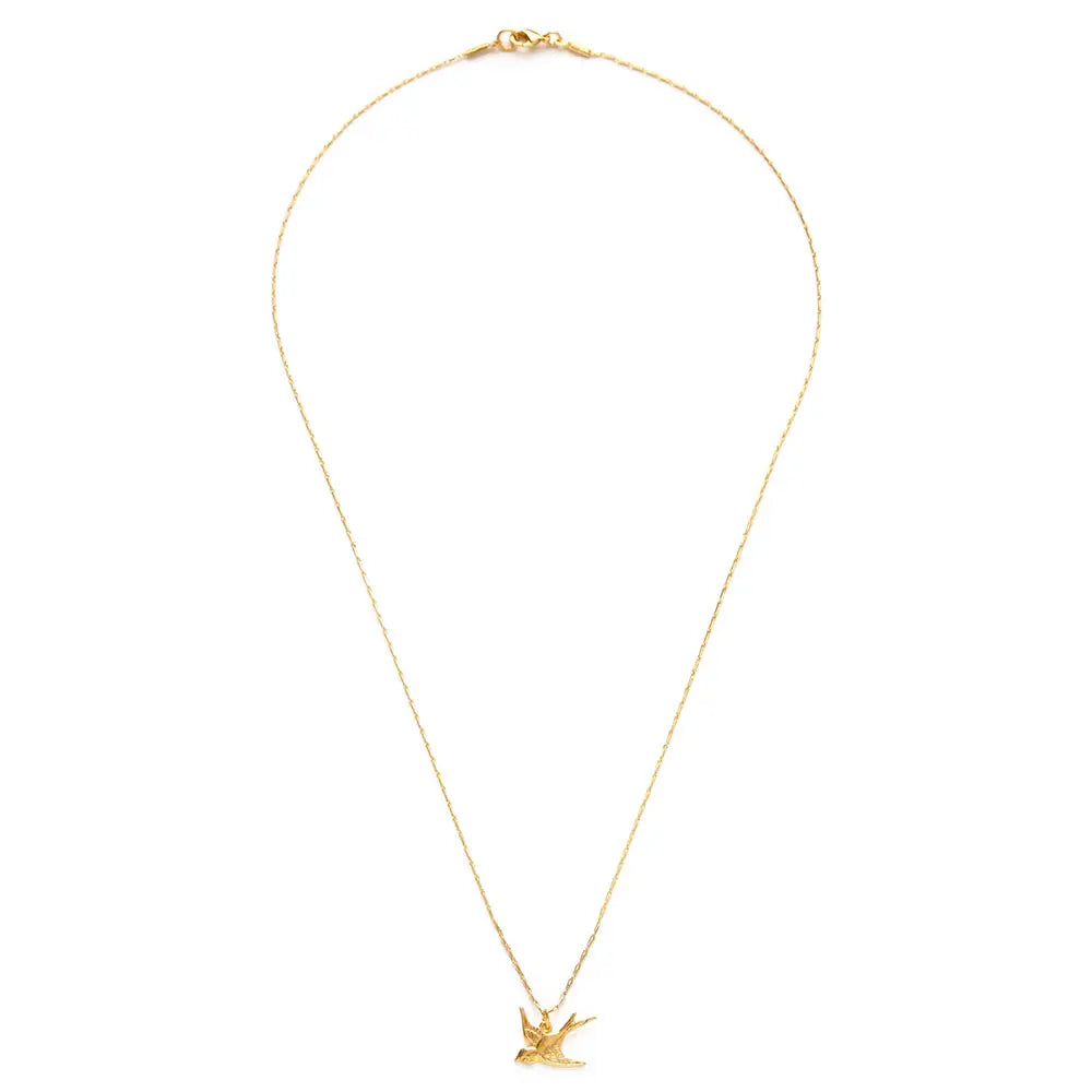gold swallow charm on a gold chain