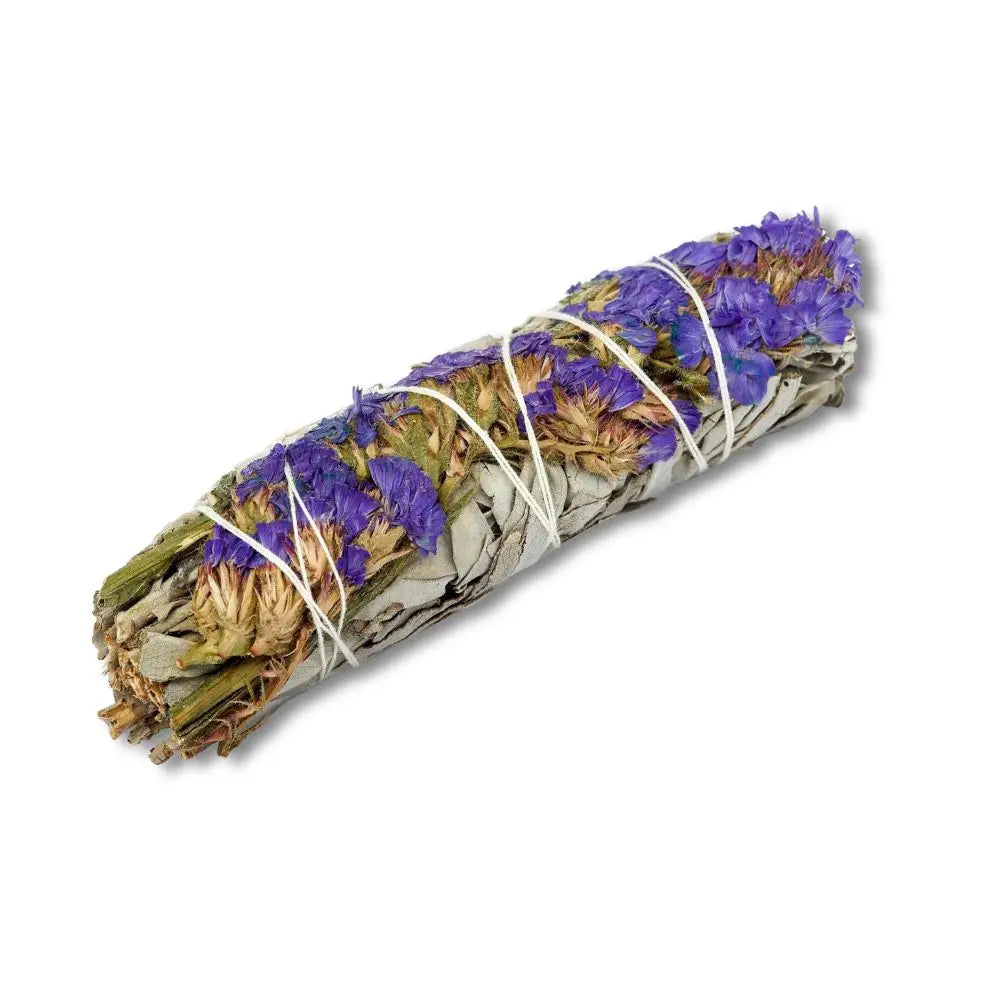 Hand-tied white sage bundle wrapped with blue sinuata flowers and white string.