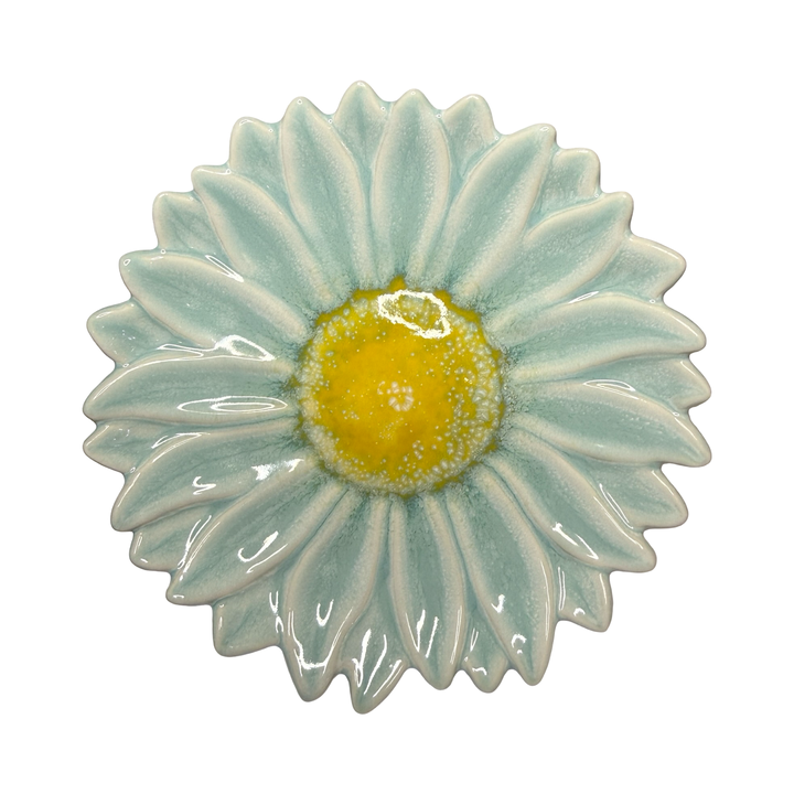 Stoneware flower-shaped dish in aqua with a yellow center glaze