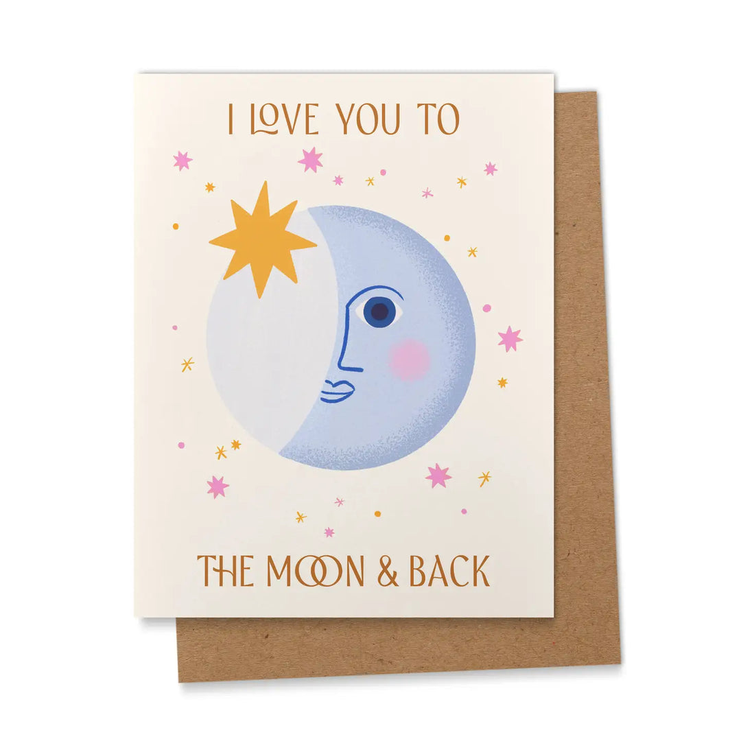 A greeting card with an illustration of a moon and stars, featuring the text "I Love You to the Moon & Back" in gold lettering, paired with a kraft envelope.