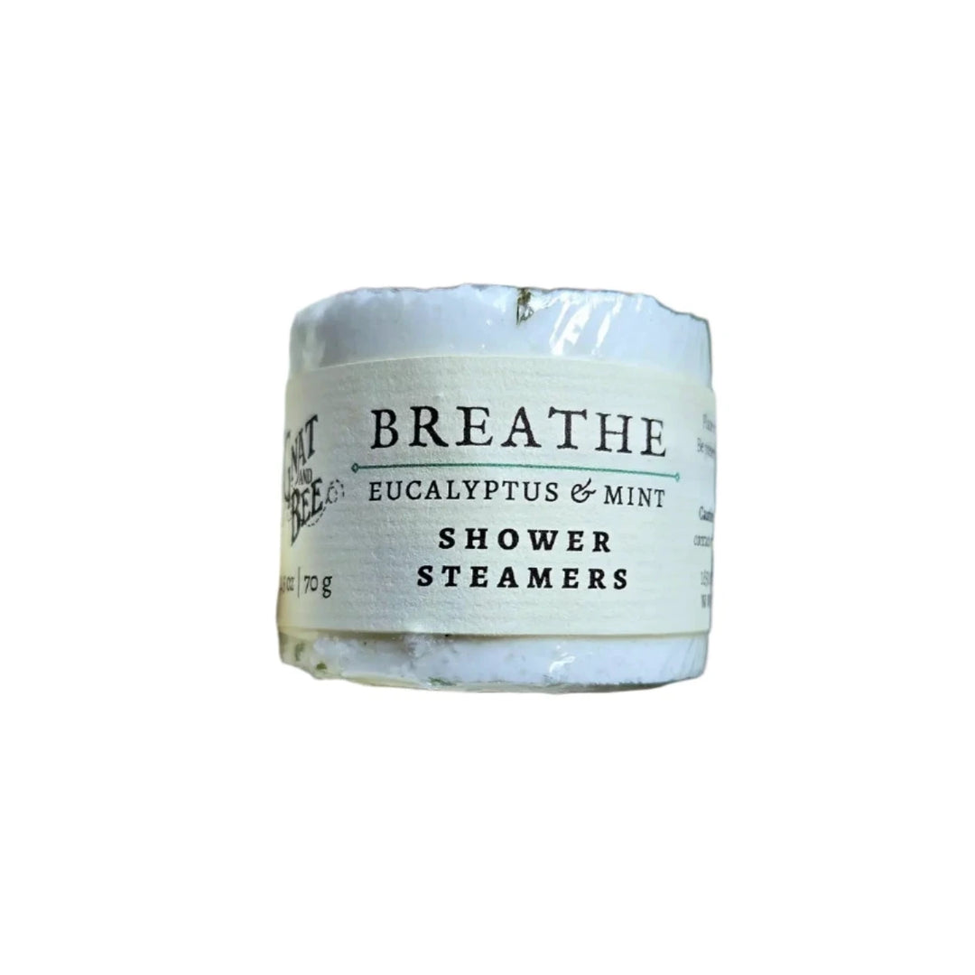 Eucalyptus and mint shower steamers labeled "Breathe,"