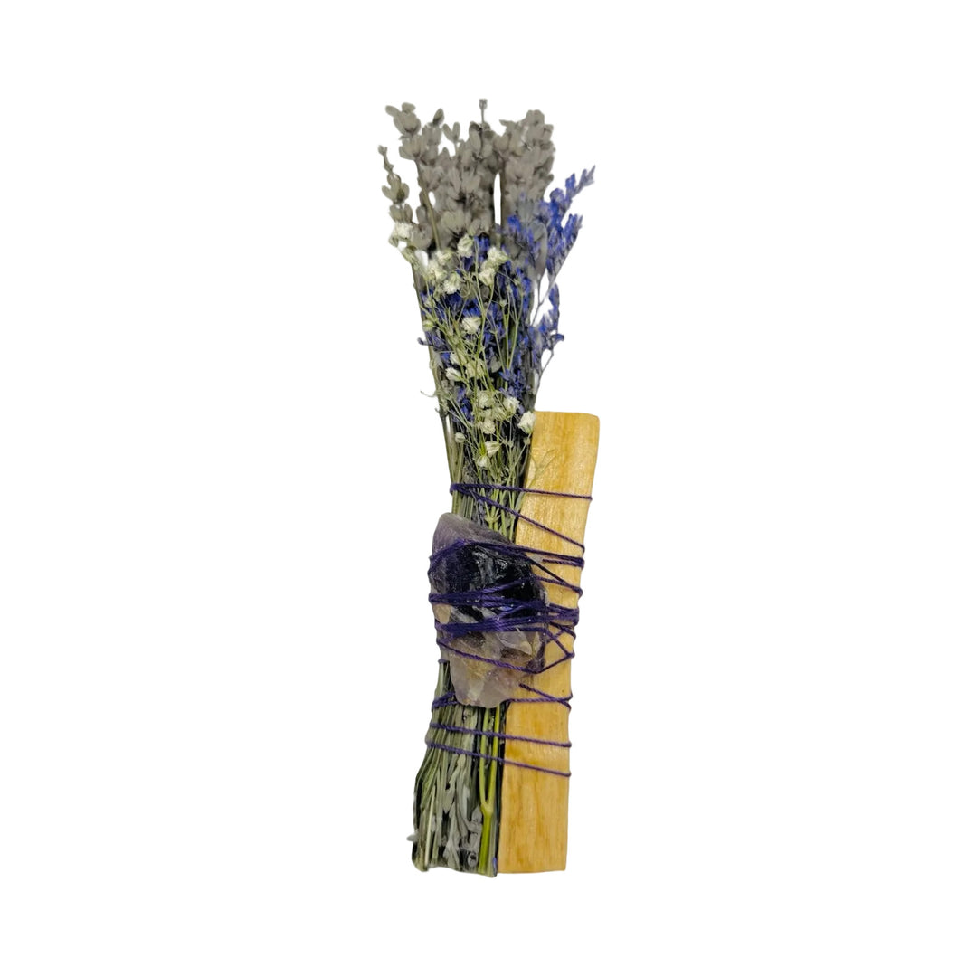 Dried lavender smudge stick with a palo santo stick and amethyst crystal wrapped in purple thread.