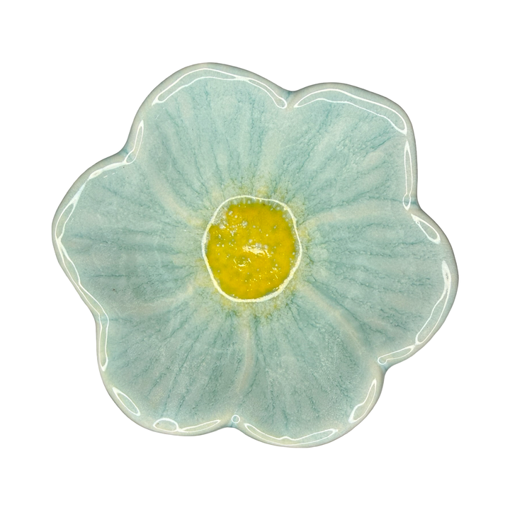 Stoneware flower-shaped bowl in light aqua with a golden center glaze.