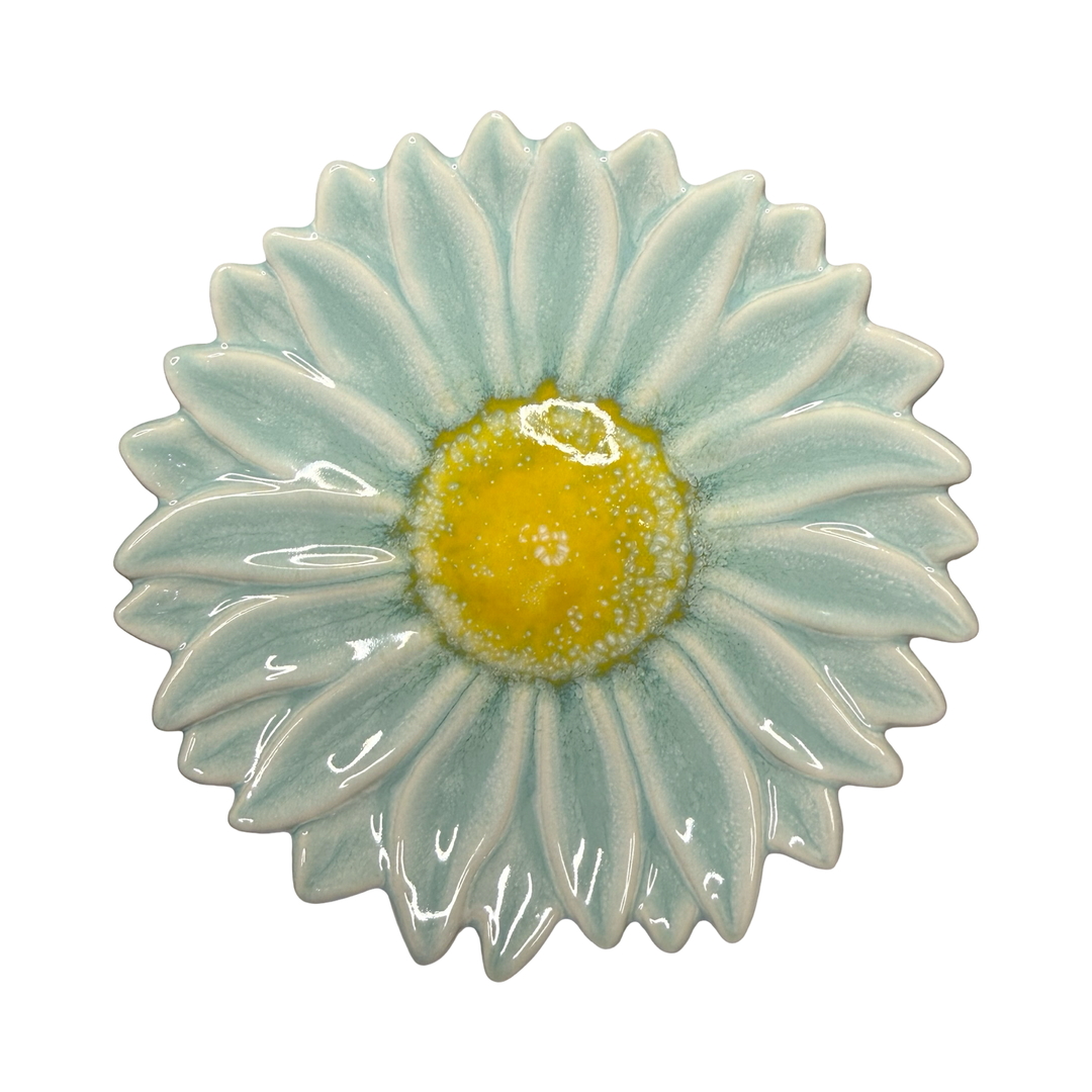 Stoneware flower-shaped dish in aqua with a yellow center glaze