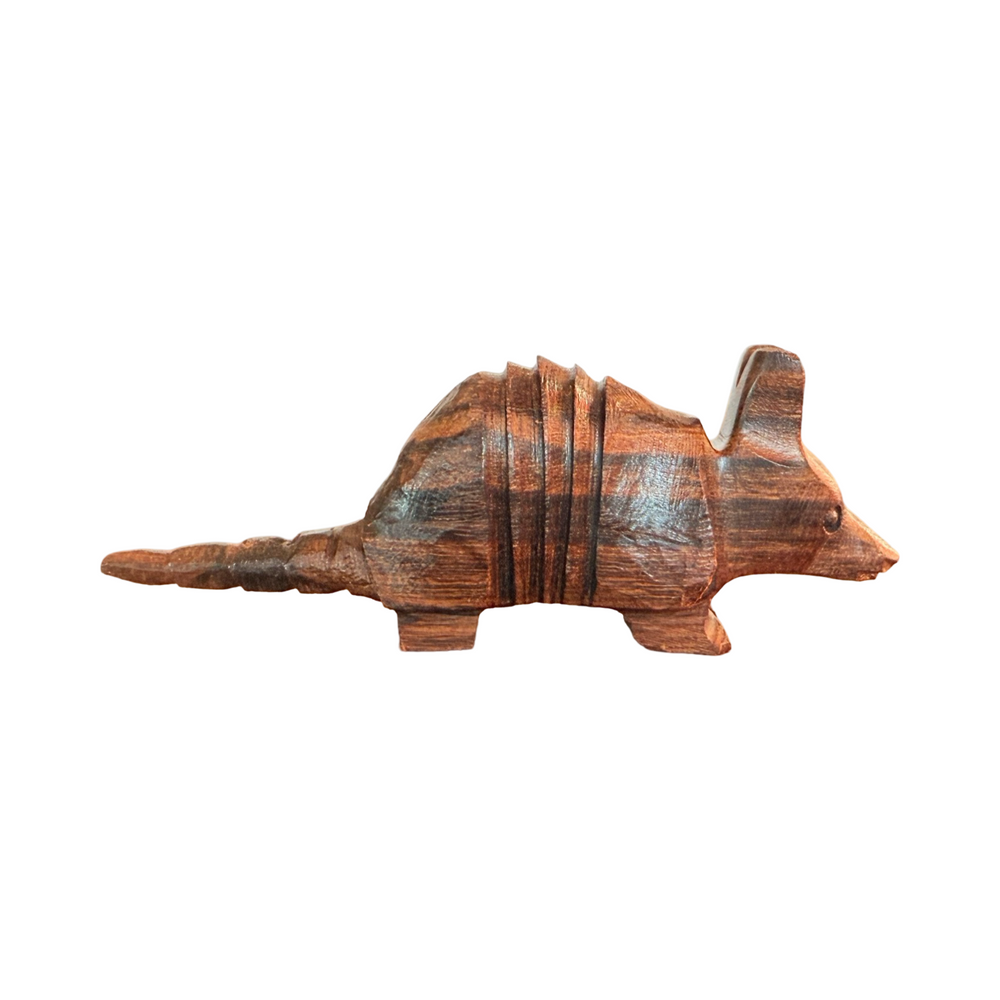 Handcarved wooden armadillo sculpture made from polished ironwood with natural grain variations.