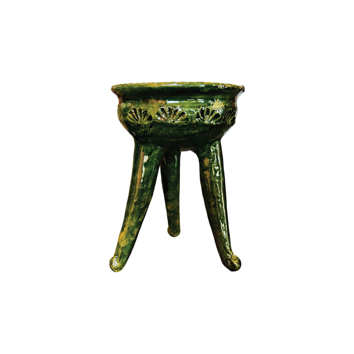 Green ceramic copalero with a stamped design.