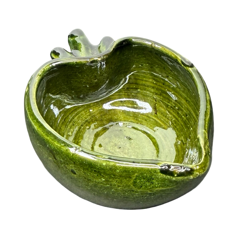 side view of a Green ceramic heart-shaped bowl with a glossy glaze