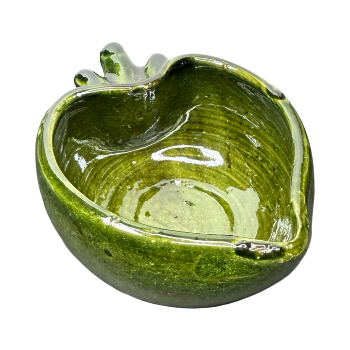 side view of a Green ceramic heart-shaped bowl with a glossy glaze