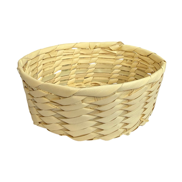 side view of a handwoven natural palm leaf basket with a rectangular shape and diagonal weave pattern.