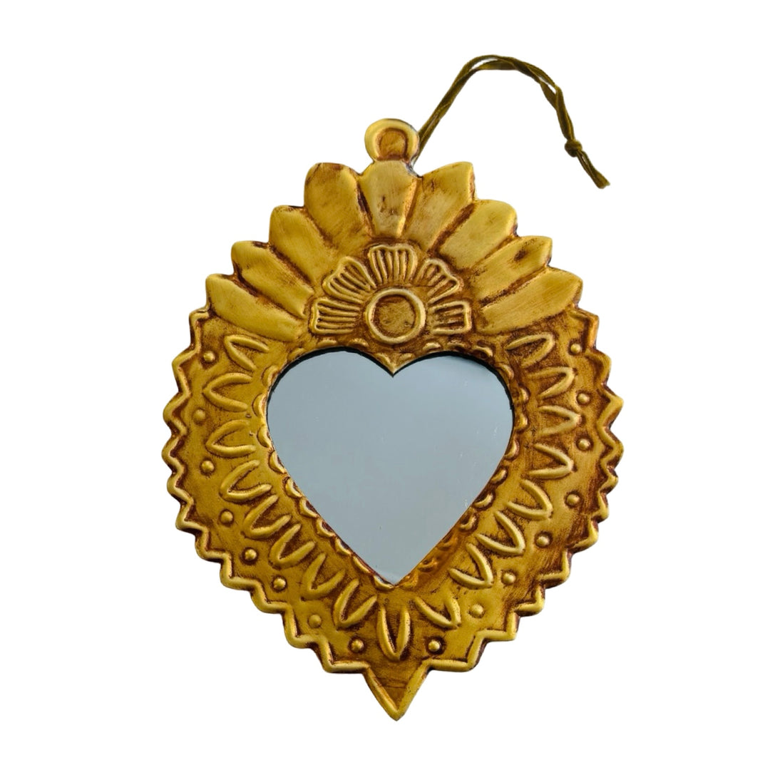 Medium-sized gold-toned Sacred Heart mirror with embossed details.