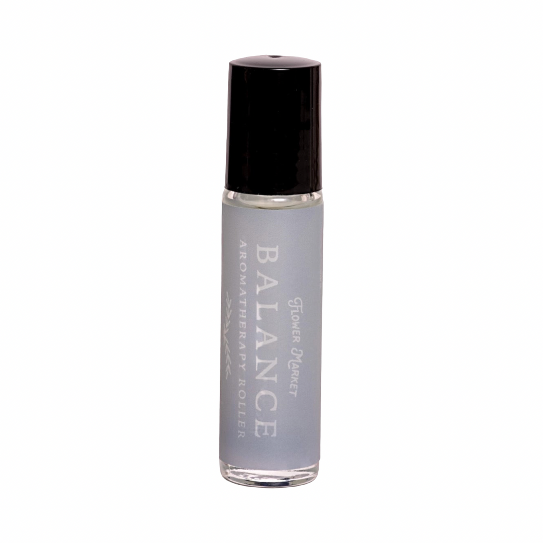 10 ml Balance Aromatherapy Roller in a clear glass bottle with a blue stone roller ball and soft gray label.