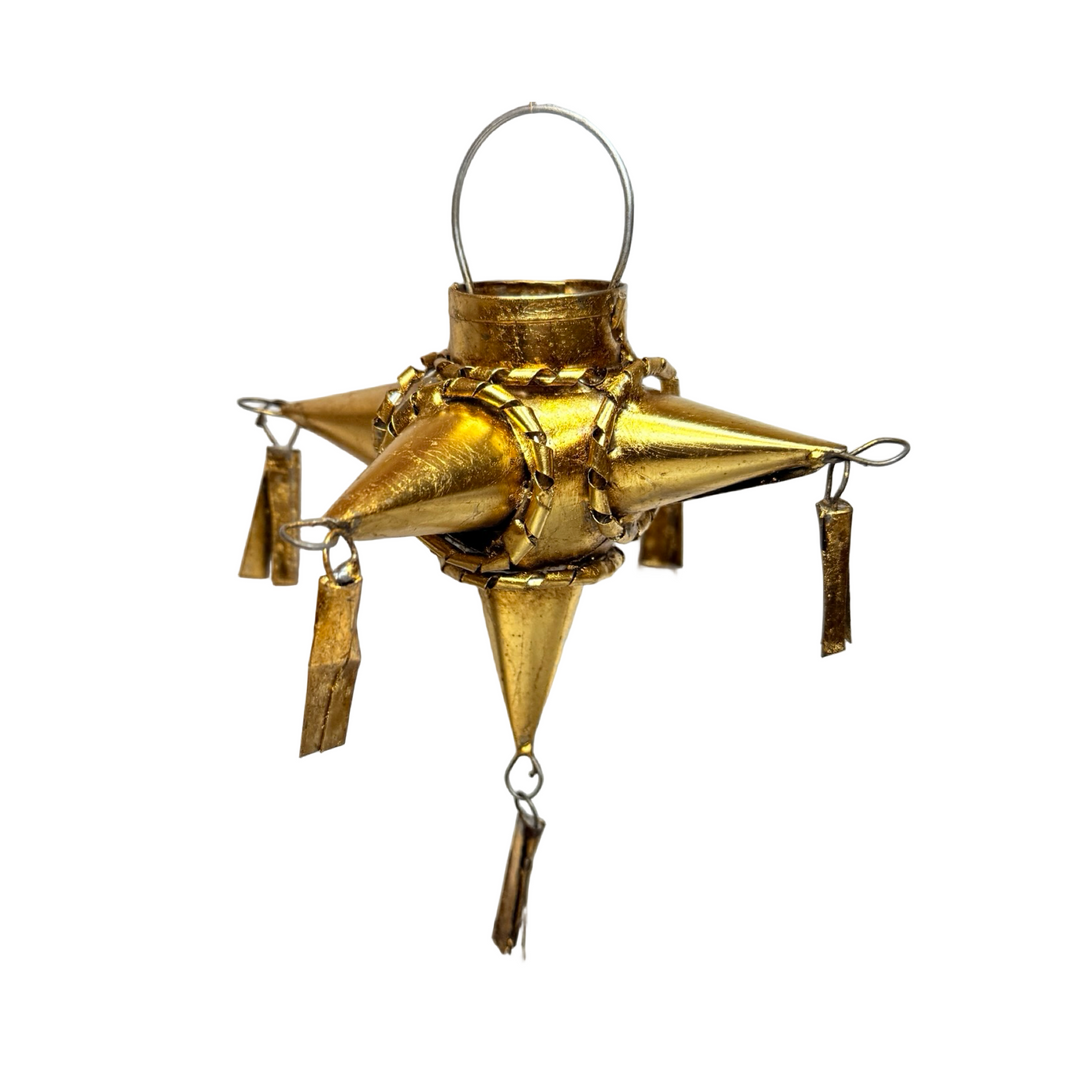 Brass-toned Metal Star Pinata Ornament featuring tassels on each point of the star and a metal loop for hanging.