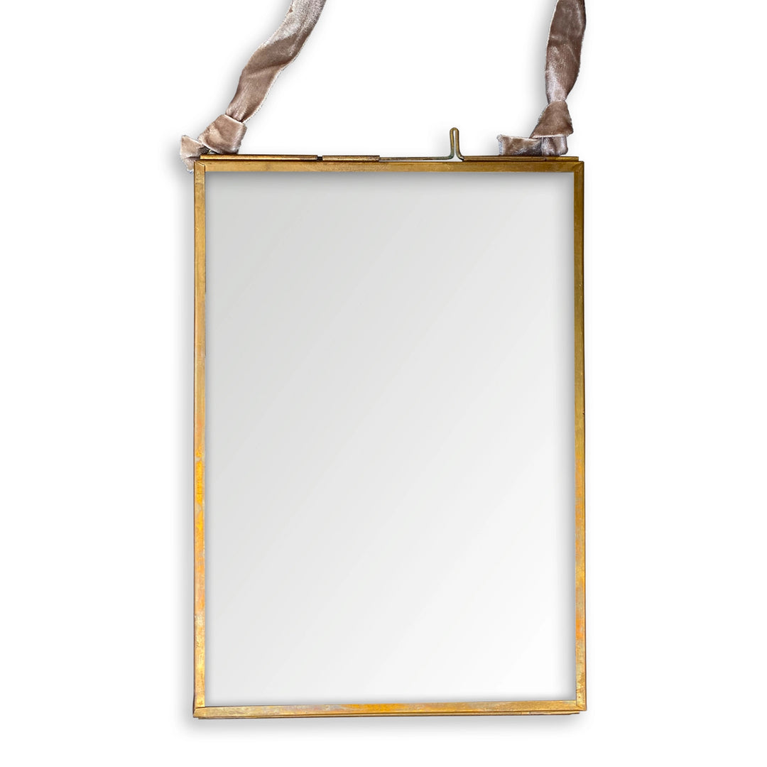 Vertical glass picture frame with slim metal border and ribbon hanger for displaying photos or artwork.