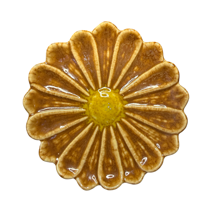 Stoneware flower-shaped dish in brown with a yellow center glaze