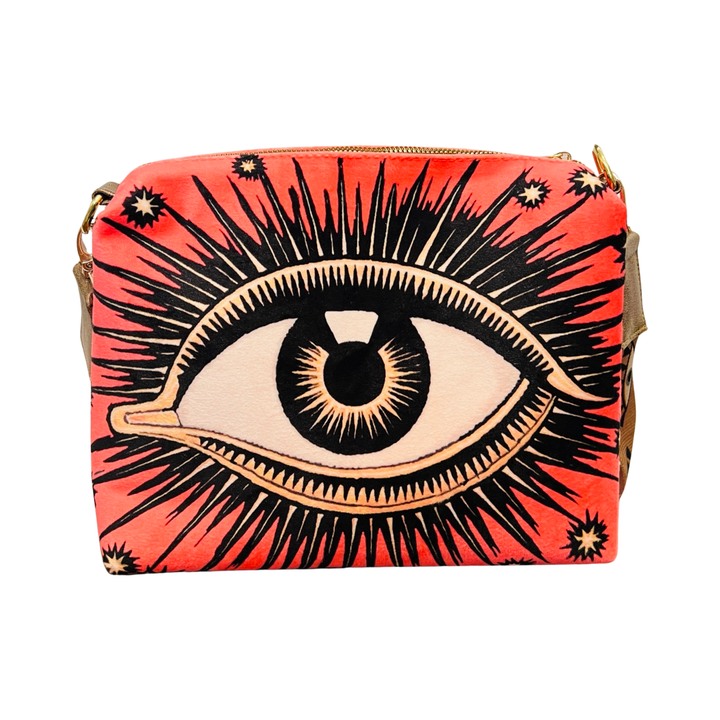 coral bag with an image of an eye featuring eyelashes and stars