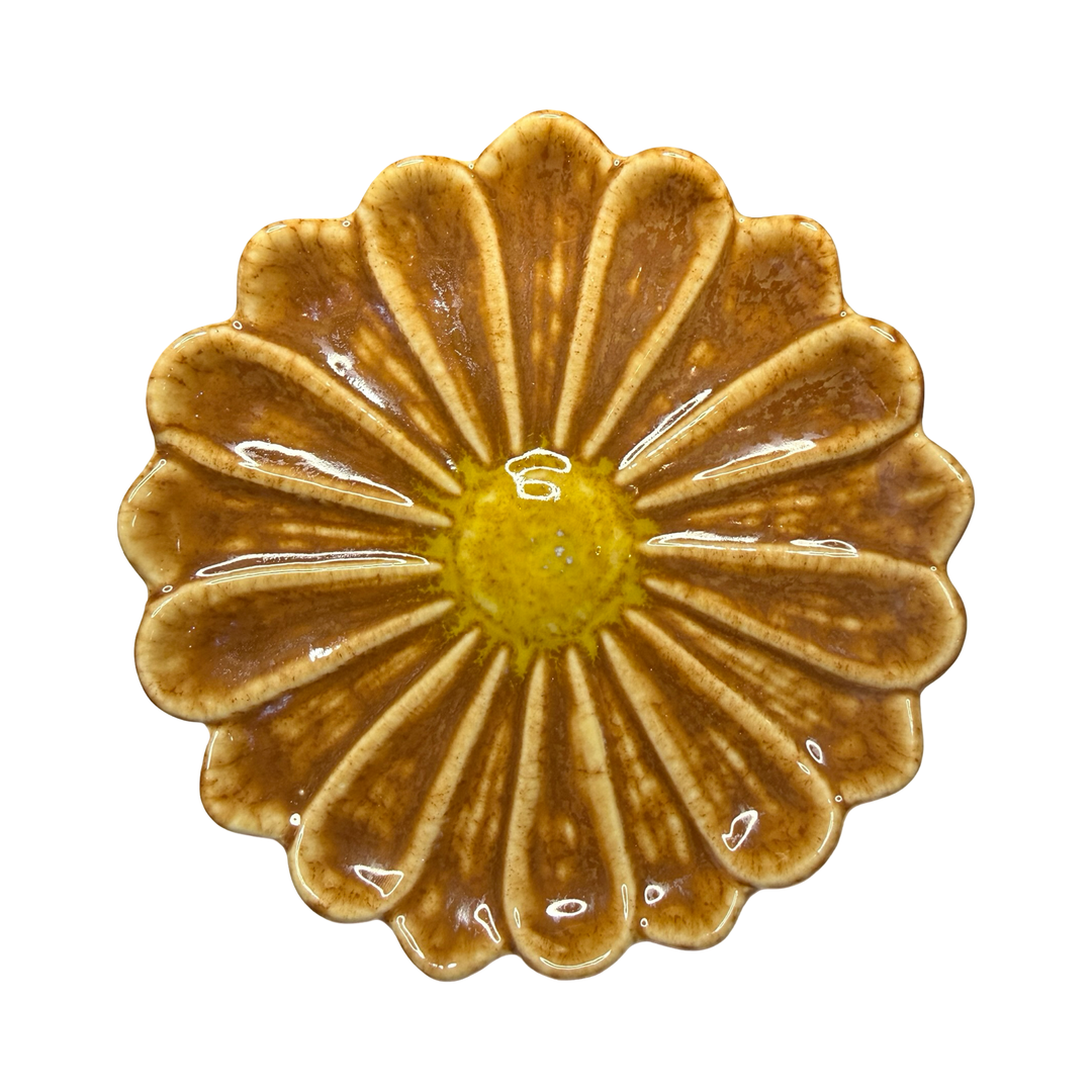 Stoneware flower-shaped dish in brown with a yellow center glaze