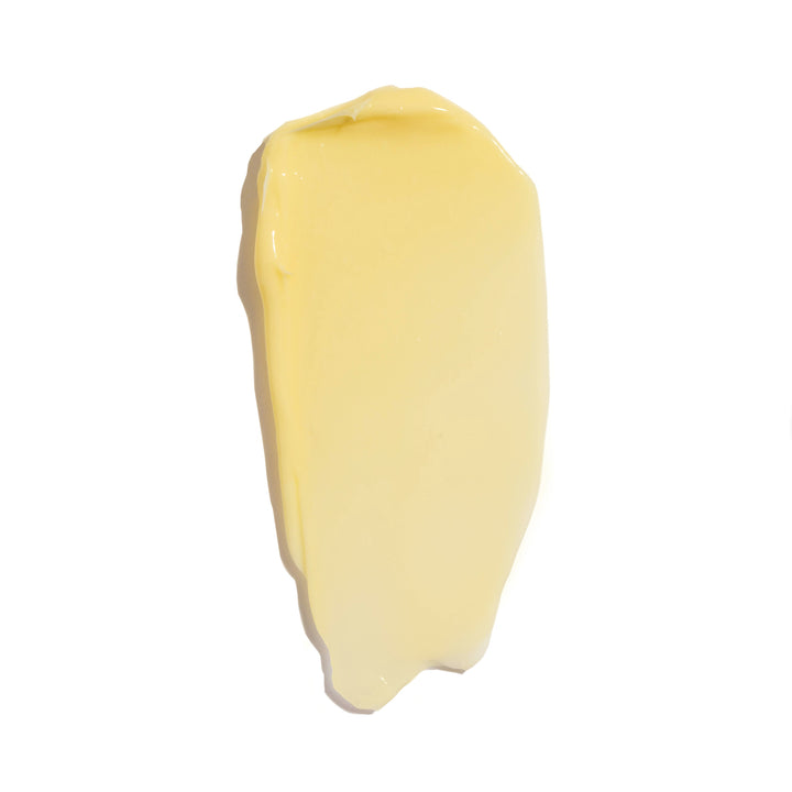 A dollop of cream colored cactus creme on a white background.