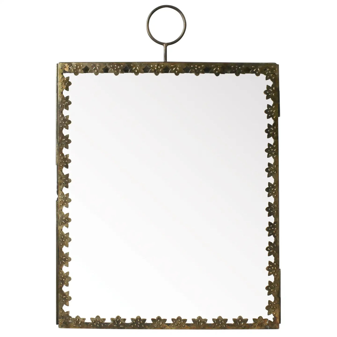 A brass hanging frame with a floral border, featuring a hinged design for inserting photos or keepsakes, topped with a round loop for hanging.