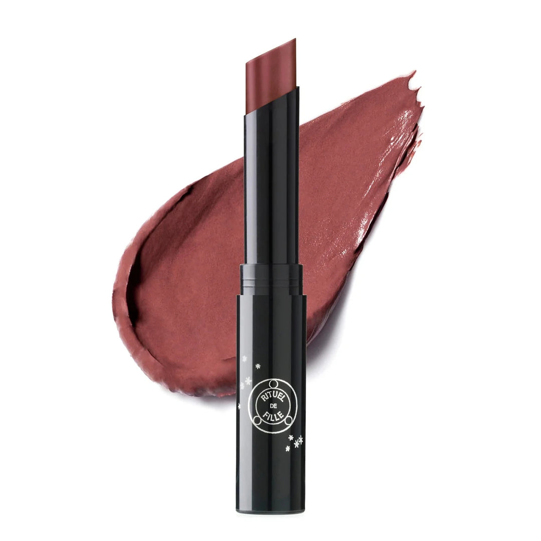 black branded tube of rose shade lipstick with a color swatch behind it. Brand: Rituel De Fille