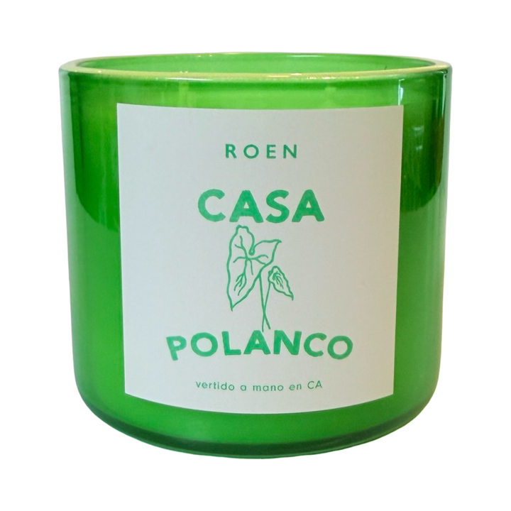 Photo of green candle jar with branded label that reads "Roen - Casa Polanco - Vertido a mano en CA"