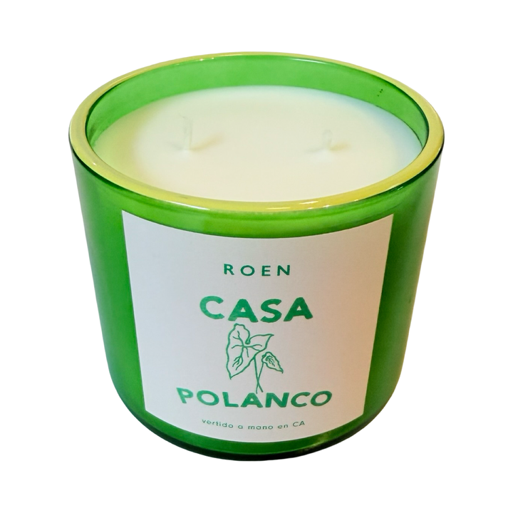 Top view of green candle jar with branded label that reads "Roen - Casa Polanco - Vertido a mano en CA"