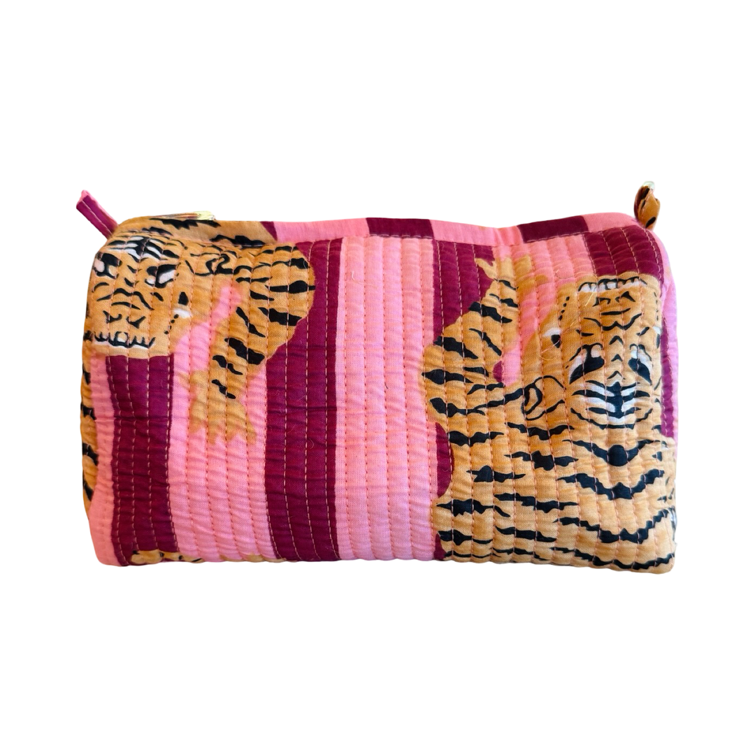 Quilted zippered make-up bag features light and pink stripes underneath illustrated tigers.