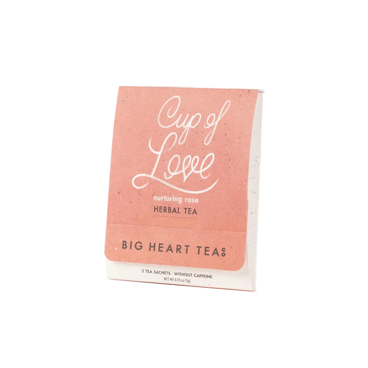 Cup of Love herbal tea packet with nurturing rose blend and two tea sachets inside.