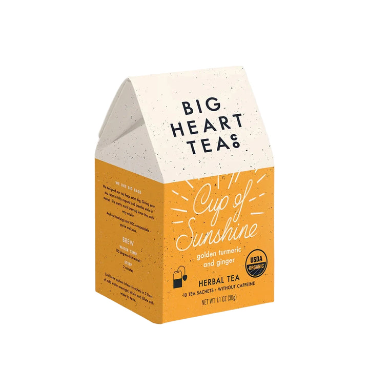 Big Heart Tea Cup of Sunshine herbal tea box featuring golden turmeric and ginger blend.