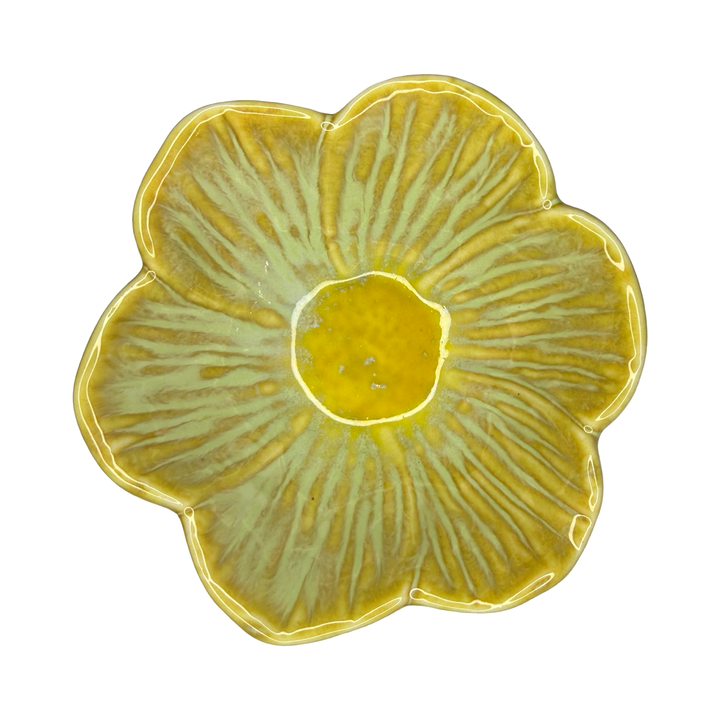 Stoneware flower-shaped bowl in mustard yellow with a golden center glaze.