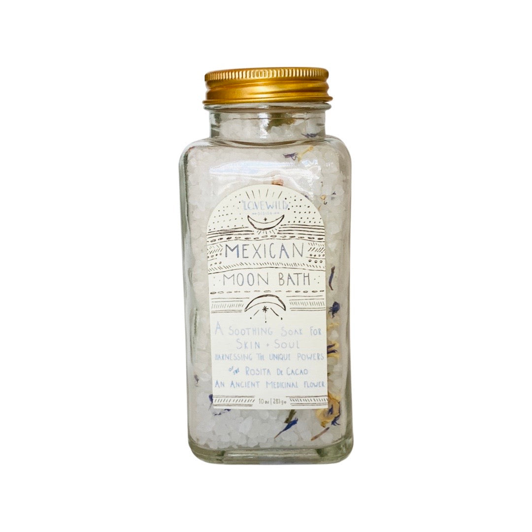 10oz clear jar of Mexican Moon Bath Salt with a gold cap and white branded label. Brand: Lovewild Design